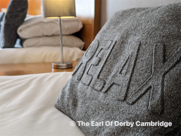 People at a concert facing the stage with various colours of paint powder in the air